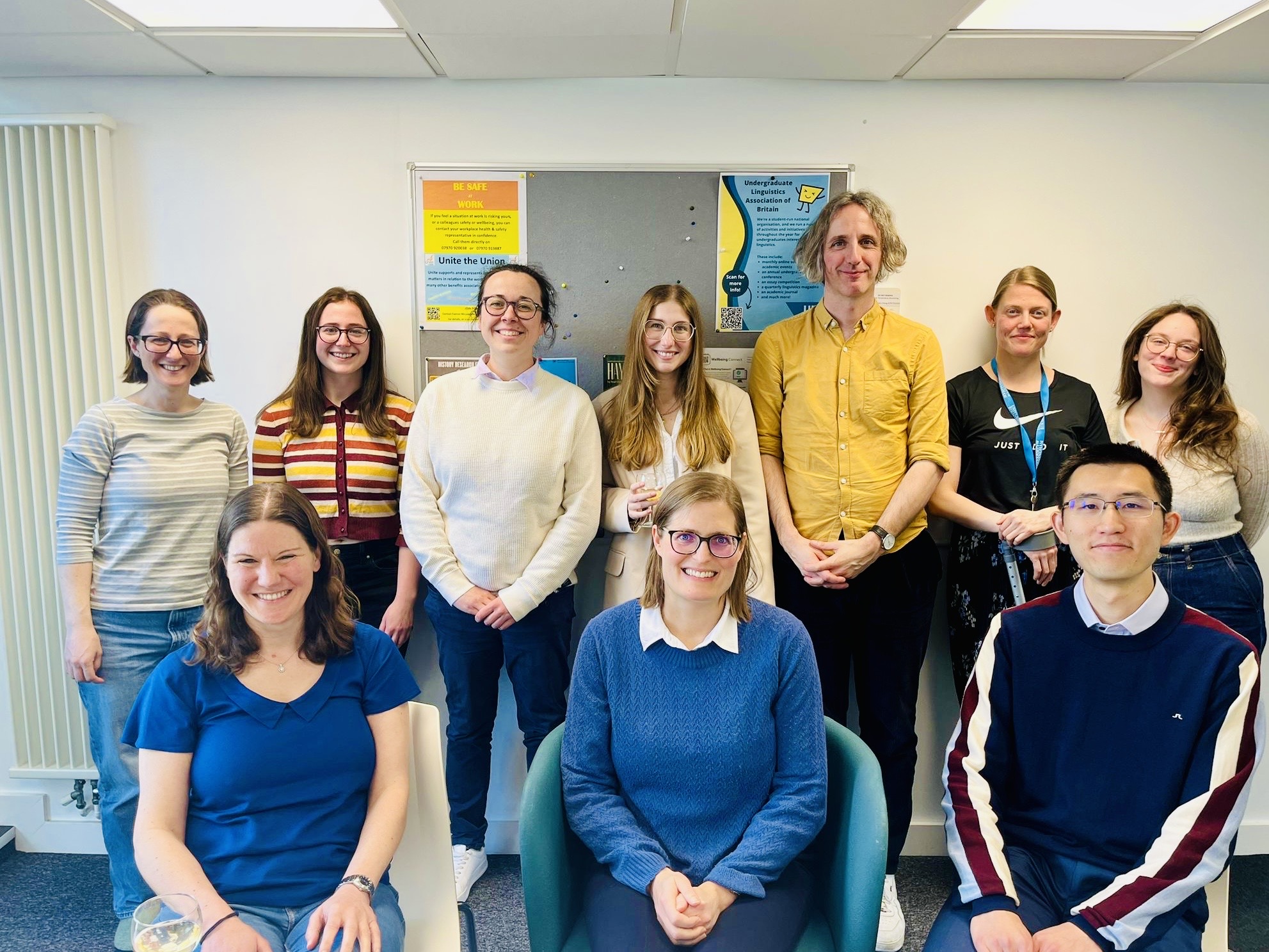 Lois (back centre) surrounded by members of the Phonetics Lab (back), together with viva chair Silke Brandt (front left), external examiner Kirsty McDougall (front centre) and internal examiner Justin Lo (front right).